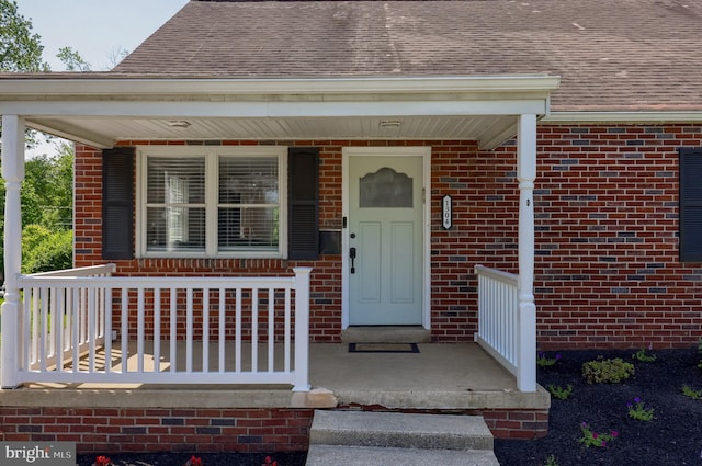 1304 Maple Ave, Lancaster, PA 17603 - entrance to property featuring covered porch, brick siding, and a shingled roof