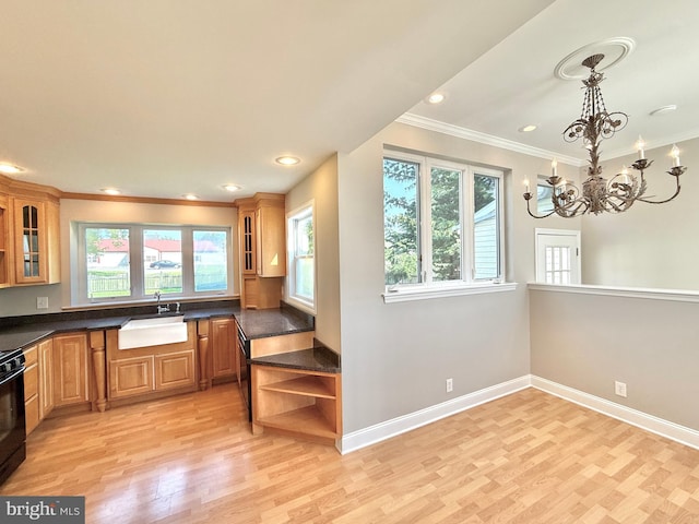 504 Redrow Ave, Swedesboro, NJ 08085 - kitchen with open shelves, light wood-style flooring, dark countertops, crown molding, and a chandelier