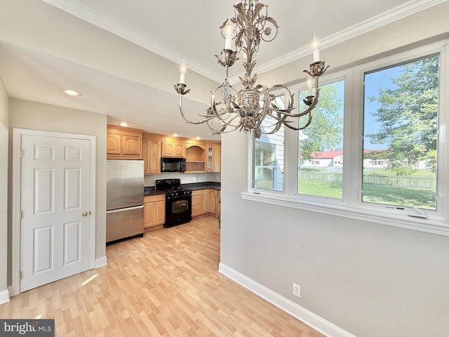 504 Redrow Ave, Swedesboro, NJ 08085 - kitchen with black appliances, a chandelier, dark countertops, light wood-style flooring, and crown molding