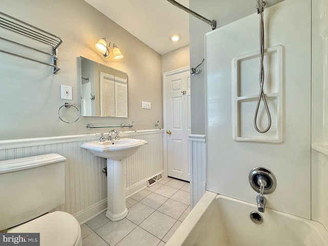 504 Redrow Ave, Swedesboro, NJ 08085 - bathroom with tile patterned floors, wainscoting, and shower / tub combo with curtain
