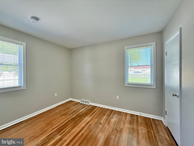 504 Redrow Ave, Swedesboro, NJ 08085 - unfurnished room with wood finished floors and a smoke detector