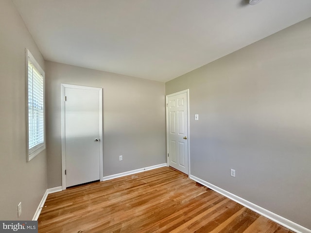 504 Redrow Ave, Swedesboro, NJ 08085 - empty room with light wood finished floors and baseboards