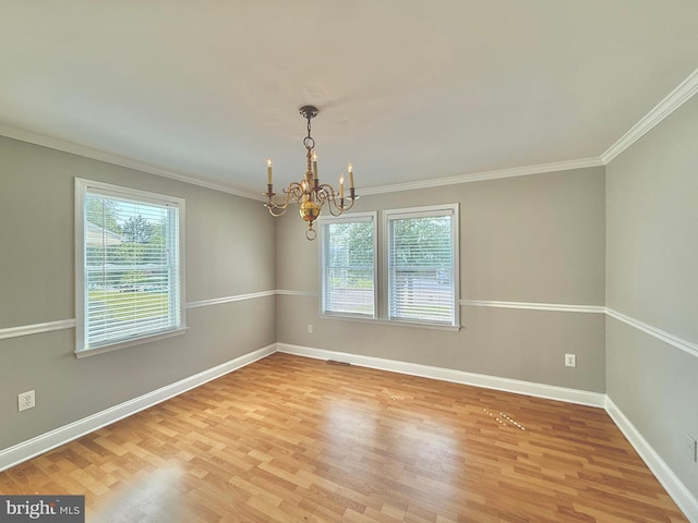 504 Redrow Ave, Swedesboro, NJ 08085 - empty room with healthy amount of natural light, light wood finished floors, a chandelier, and ornamental molding