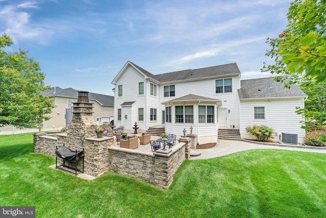 1427 Olmsted Dr, Bear, DE 19701 - back of house with a patio area, a yard, entry steps, an outdoor living space with a fireplace, and roof with shingles