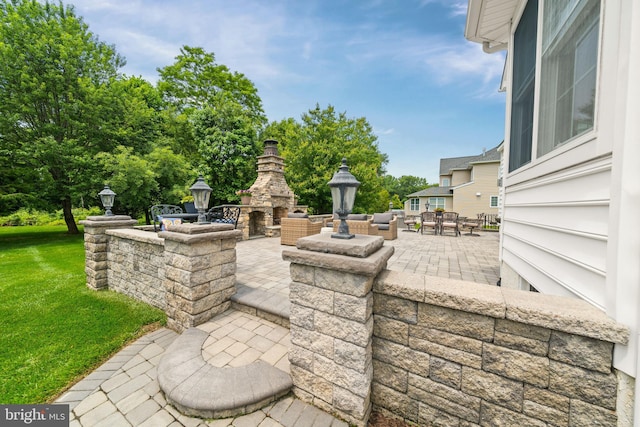 1427 Olmsted Dr, Bear, DE 19701 - view of patio featuring an outdoor stone fireplace and outdoor dining area