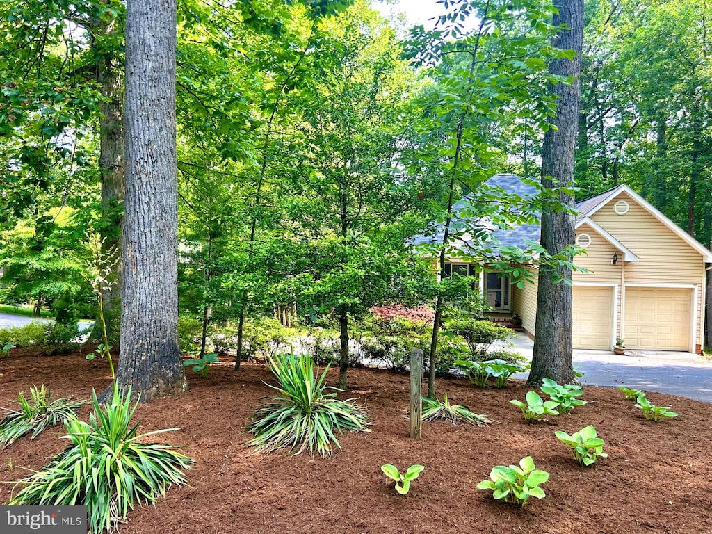 101 Battlefield Rd, Locust Grove, VA 22508 - obstructed view of property with driveway and an attached garage