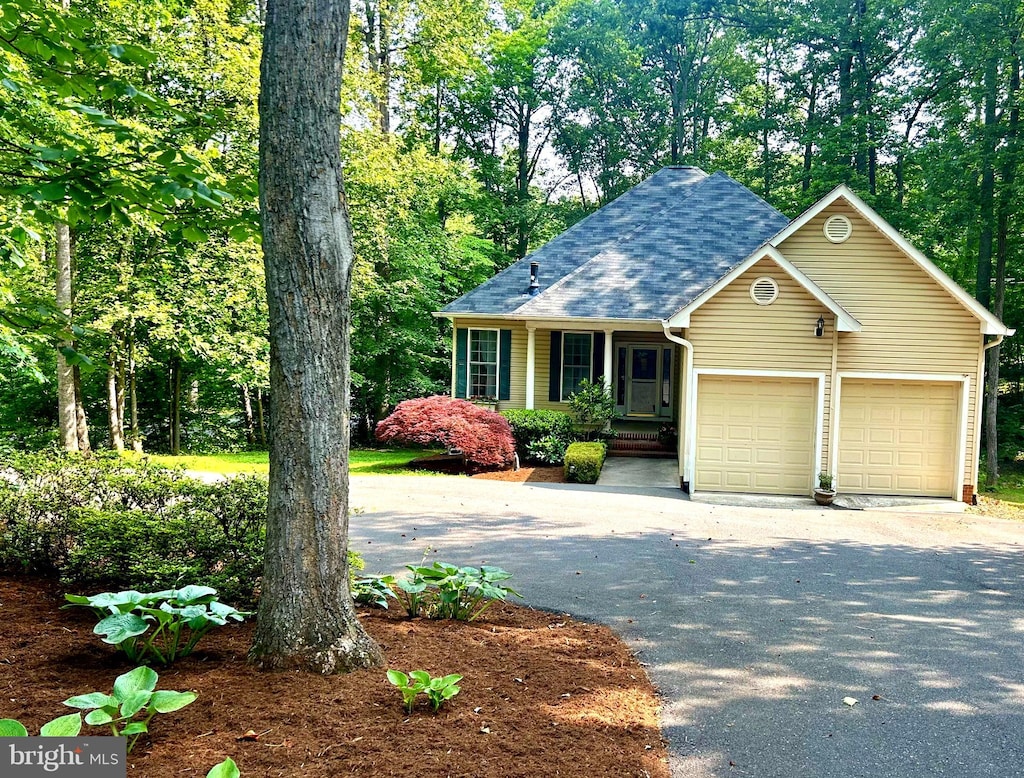 101 Battlefield Rd, Locust Grove, VA 22508 - view of front of house featuring asphalt driveway, an attached garage, and a shingled roof