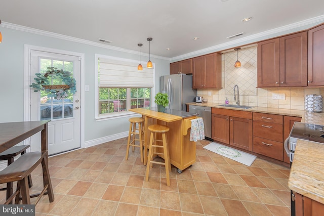 621 Foxton Ct, West Deptford, NJ 08051 - kitchen featuring a sink, stainless steel appliances, crown molding, backsplash, and a kitchen breakfast bar