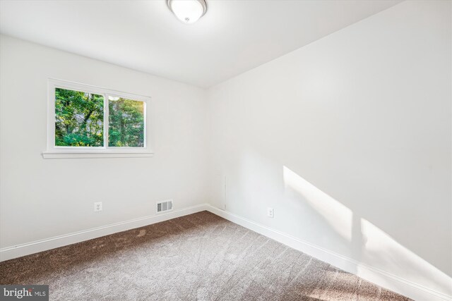 5202 Bayne Pl, Temple Hills, MD 20748 - carpeted spare room with baseboards