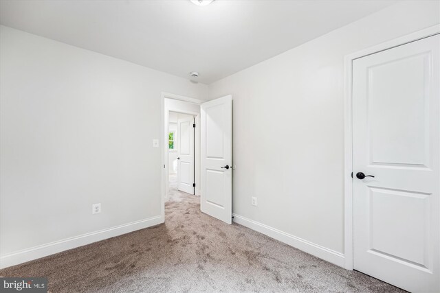 5202 Bayne Pl, Temple Hills, MD 20748 - unfurnished bedroom featuring carpet and baseboards