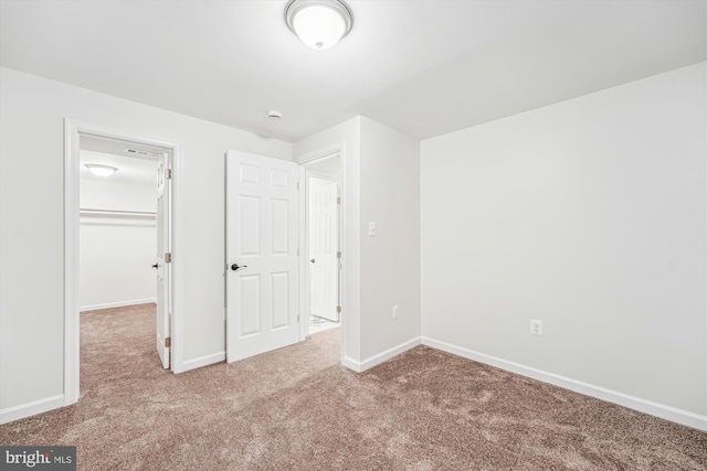 5202 Bayne Pl, Temple Hills, MD 20748 - unfurnished bedroom featuring carpet floors, a spacious closet, baseboards, and a closet