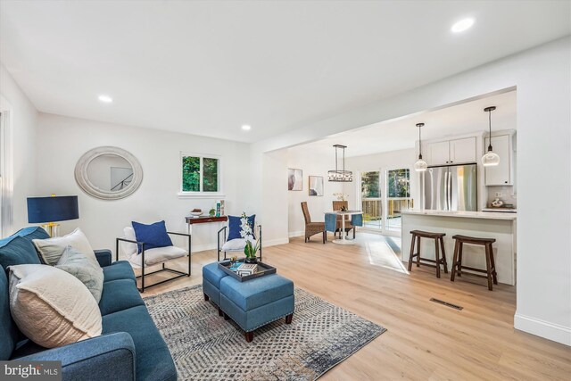 5202 Bayne Pl, Temple Hills, MD 20748 - living room featuring healthy amount of natural light, light wood-style flooring, baseboards, and recessed lighting