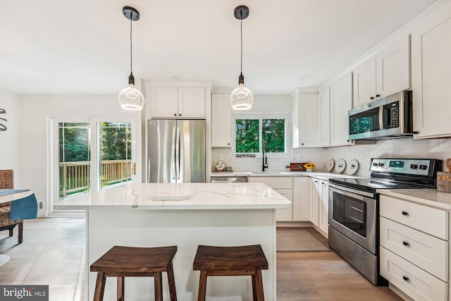 5202 Bayne Pl, Temple Hills, MD 20748 - kitchen with stainless steel appliances, a sink, decorative backsplash, and white cabinets