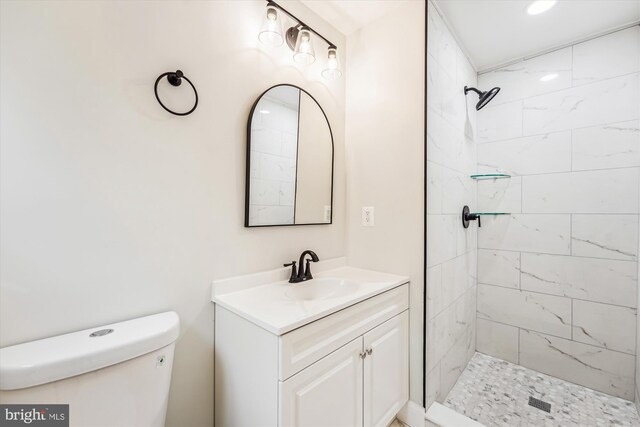 5202 Bayne Pl, Temple Hills, MD 20748 - bathroom featuring toilet, vanity, and a tile shower