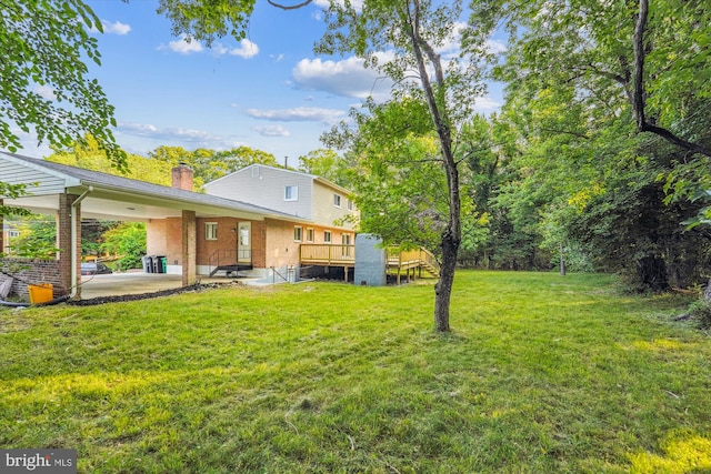 5202 Bayne Pl, Temple Hills, MD 20748 - view of green lawn with a patio area and a wooden deck