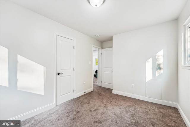 5202 Bayne Pl, Temple Hills, MD 20748 - unfurnished bedroom featuring carpet and baseboards
