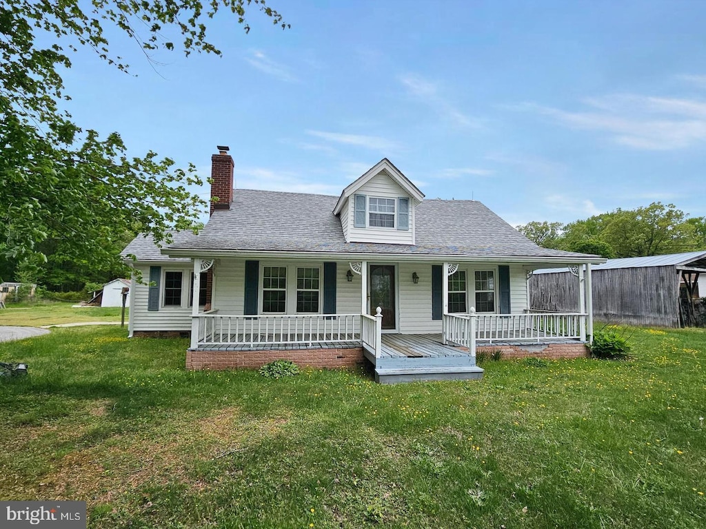 22333 Colton Point Rd, Bushwood, MD 20618 - view of front of home with a chimney, a porch, and a front lawn