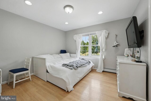 6622 Skyline Ct, Alexandria, VA 22307 - bedroom featuring a baseboard heating unit, light wood finished floors, recessed lighting, and baseboards