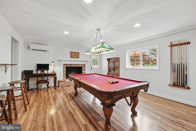 6622 Skyline Ct, Alexandria, VA 22307 - recreation room with a wall mounted AC, ornamental molding, plenty of natural light, light wood-style flooring, and recessed lighting