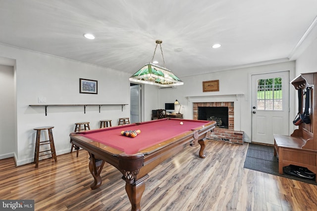 6622 Skyline Ct, Alexandria, VA 22307 - playroom with a brick fireplace, wood finished floors, recessed lighting, billiards, and ornamental molding