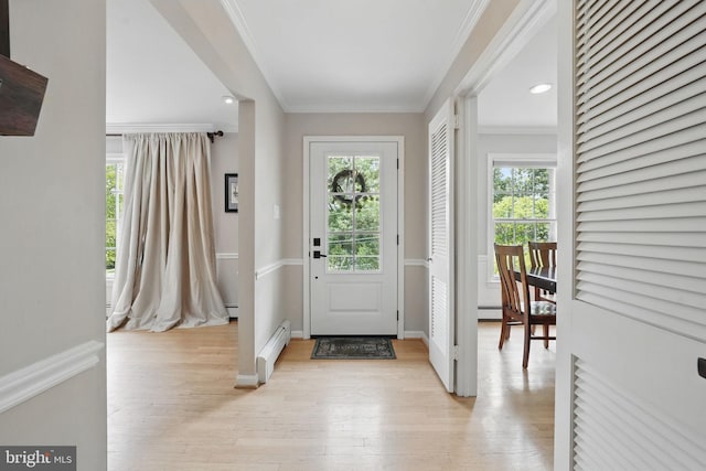 6622 Skyline Ct, Alexandria, VA 22307 - foyer featuring a baseboard heating unit, ornamental molding, light wood-style floors, baseboards, and recessed lighting