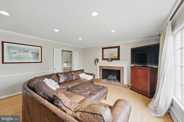 6622 Skyline Ct, Alexandria, VA 22307 - living room with a baseboard radiator, light wood finished floors, recessed lighting, a brick fireplace, and crown molding