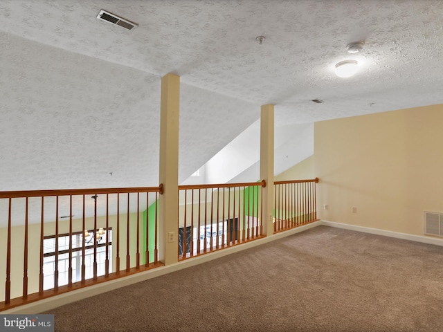 6344 Springwater Ter Unit 1141, Frederick, MD 21701 - carpeted empty room featuring a smoke detector, a textured ceiling, vaulted ceiling, and fire sprinkler in ceiling