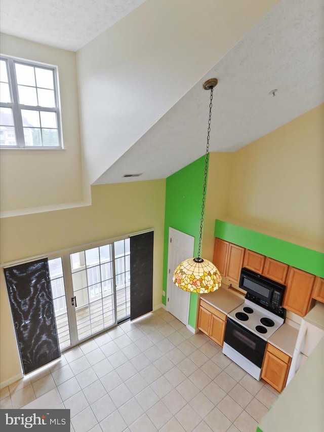 6344 Springwater Ter Unit 1141, Frederick, MD 21701 - kitchen featuring black microwave, electric range oven, light countertops, and light tile patterned flooring
