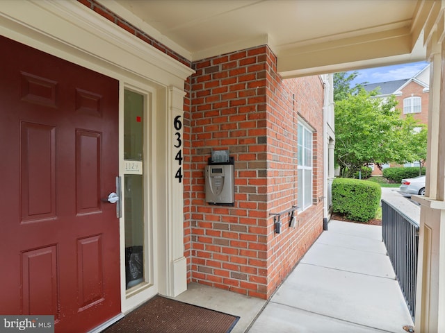 6344 Springwater Ter Unit 1141, Frederick, MD 21701 - doorway to property featuring brick siding and a porch