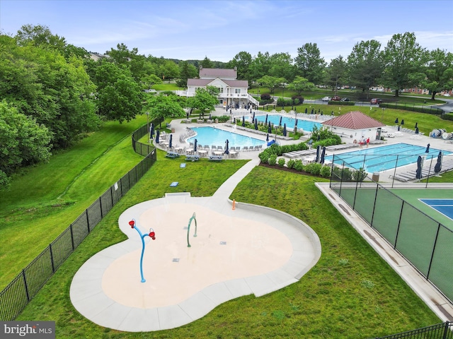 6344 Springwater Ter Unit 1141, Frederick, MD 21701 - drone / aerial view of a pool and a tree filled landscape