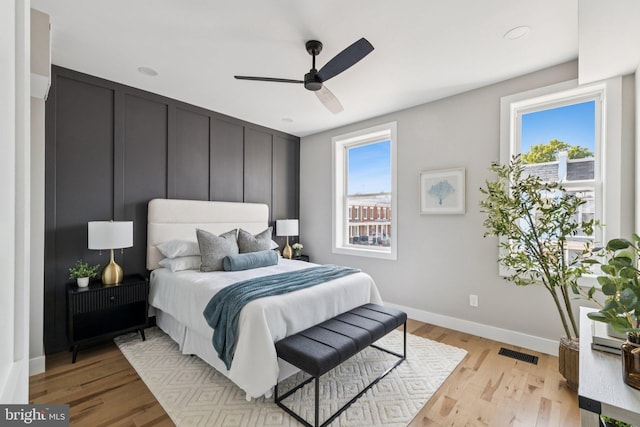 344 Elm St NW, Washington, DC 20001 - bedroom with baseboards, light wood-type flooring, and a ceiling fan