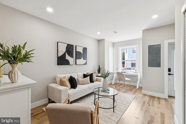 344 Elm St NW, Washington, DC 20001 - living room featuring electric panel, baseboards, light wood-type flooring, and recessed lighting