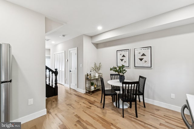 344 Elm St NW, Washington, DC 20001 - dining space featuring light wood-style floors, baseboards, recessed lighting, and stairway