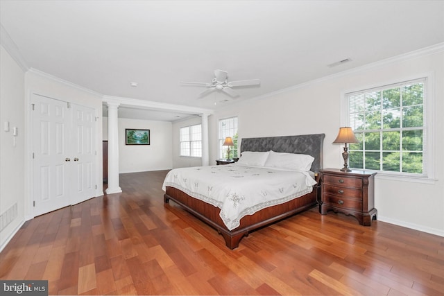915 Mather Dr, Bear, DE 19701 - bedroom featuring ornate columns, wood finished floors, crown molding, and ceiling fan