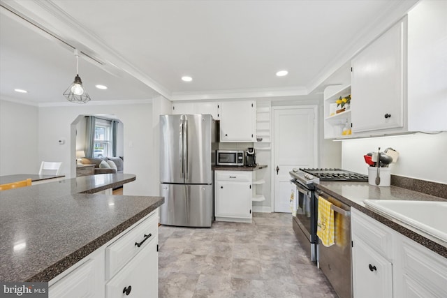 2120 Grand Ave, Morton, PA 19070 - kitchen featuring appliances with stainless steel finishes, open shelves, dark countertops, arched walkways, and white cabinetry