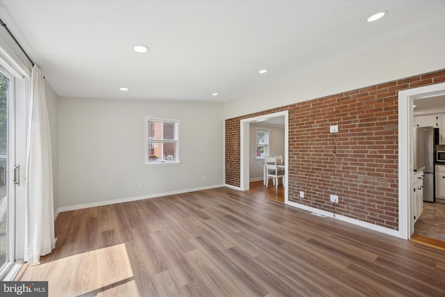 2120 Grand Ave, Morton, PA 19070 - empty room featuring brick wall, wood finished floors, baseboards, and recessed lighting