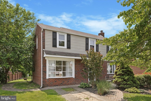 2120 Grand Ave, Morton, PA 19070 - traditional home with a chimney and brick siding
