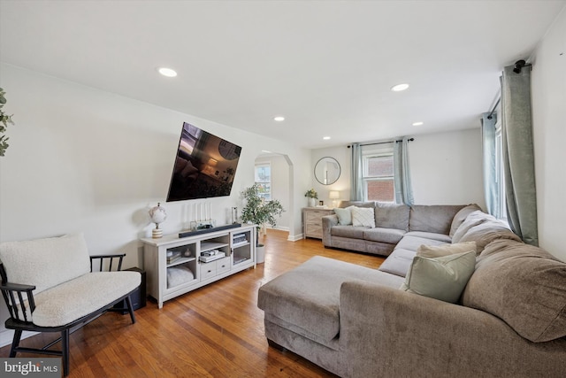 2120 Grand Ave, Morton, PA 19070 - living room with arched walkways, wood finished floors, and recessed lighting