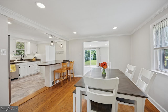 2120 Grand Ave, Morton, PA 19070 - dining room with light wood-style flooring, crown molding, recessed lighting, and baseboards