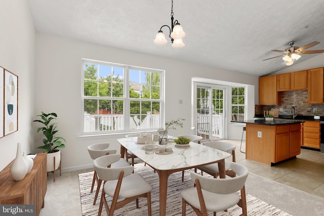 542 June Apple Ct, Abingdon, MD 21009 - dining room with plenty of natural light, a textured ceiling, a chandelier, a ceiling fan, and vaulted ceiling