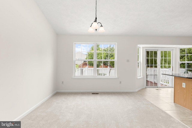 542 June Apple Ct, Abingdon, MD 21009 - unfurnished dining area with a chandelier, baseboards, a textured ceiling, and light colored carpet