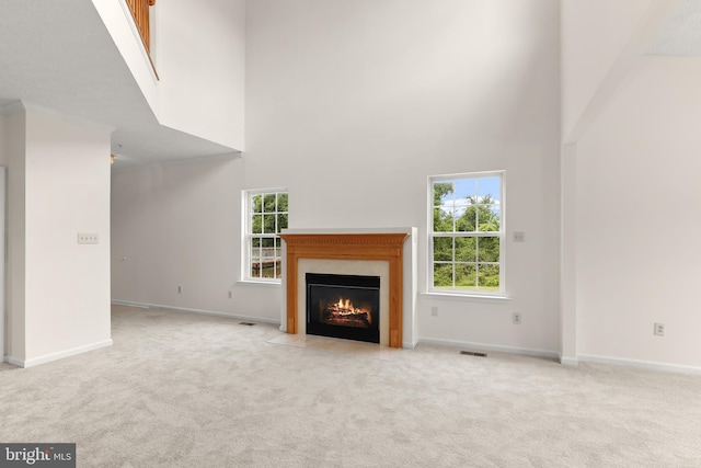 542 June Apple Ct, Abingdon, MD 21009 - unfurnished living room with a high ceiling, carpet floors, a premium fireplace, and baseboards