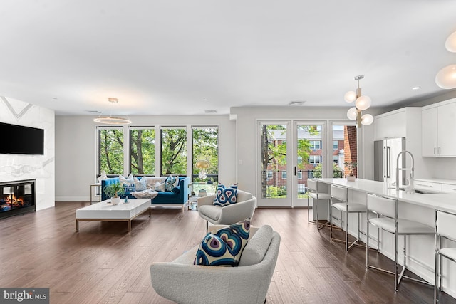 427 E Lancaster Ave Unit 1202, Wayne, PA 19087 - living area featuring dark wood-style flooring, a fireplace, and recessed lighting