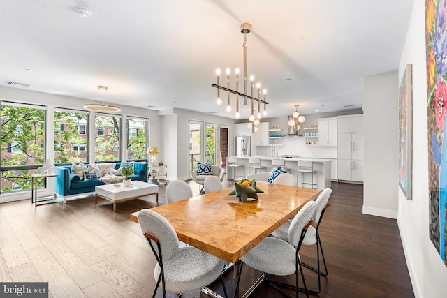 427 E Lancaster Ave Unit 1202, Wayne, PA 19087 - dining room featuring dark wood-type flooring and a chandelier