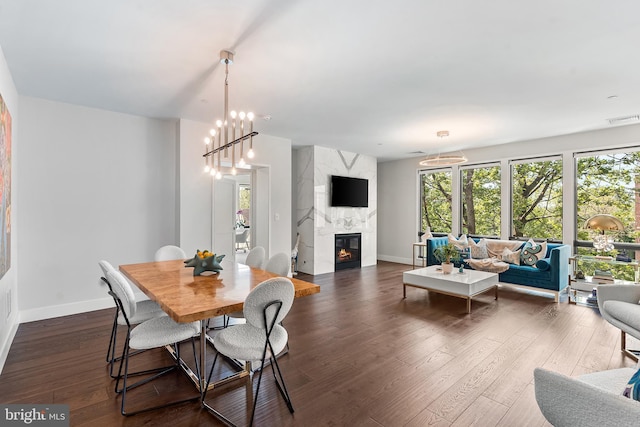 427 E Lancaster Ave Unit 1202, Wayne, PA 19087 - dining area featuring a premium fireplace and dark wood finished floors