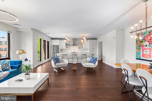 427 E Lancaster Ave Unit 1202, Wayne, PA 19087 - living area with dark wood-style flooring and baseboards
