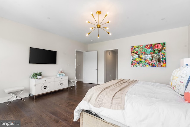 427 E Lancaster Ave Unit 1202, Wayne, PA 19087 - bedroom featuring a chandelier and dark wood-style floors