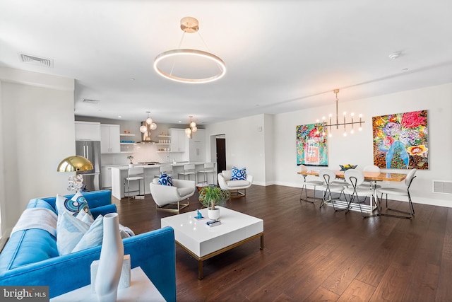 427 E Lancaster Ave Unit 1202, Wayne, PA 19087 - living room featuring a chandelier and dark wood finished floors