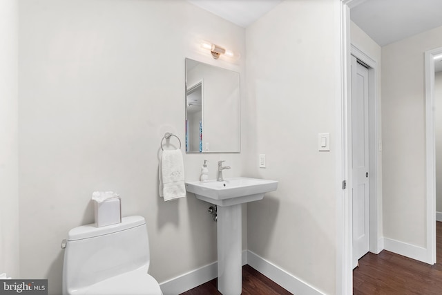 427 E Lancaster Ave Unit 1202, Wayne, PA 19087 - half bathroom featuring baseboards and wood finished floors