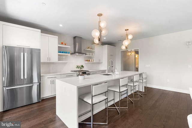 427 E Lancaster Ave Unit 1202, Wayne, PA 19087 - kitchen featuring stainless steel appliances, wall chimney range hood, open shelves, white cabinets, and recessed lighting